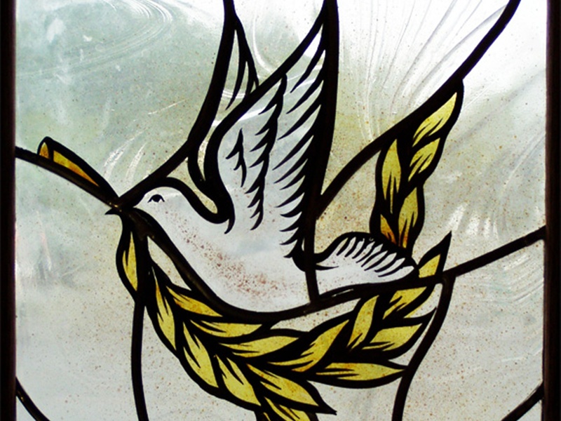 stained glass dove with olive branch